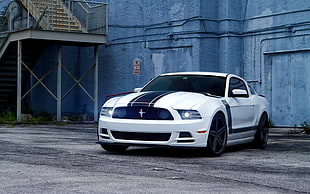 white and black Ford Mustang coupe