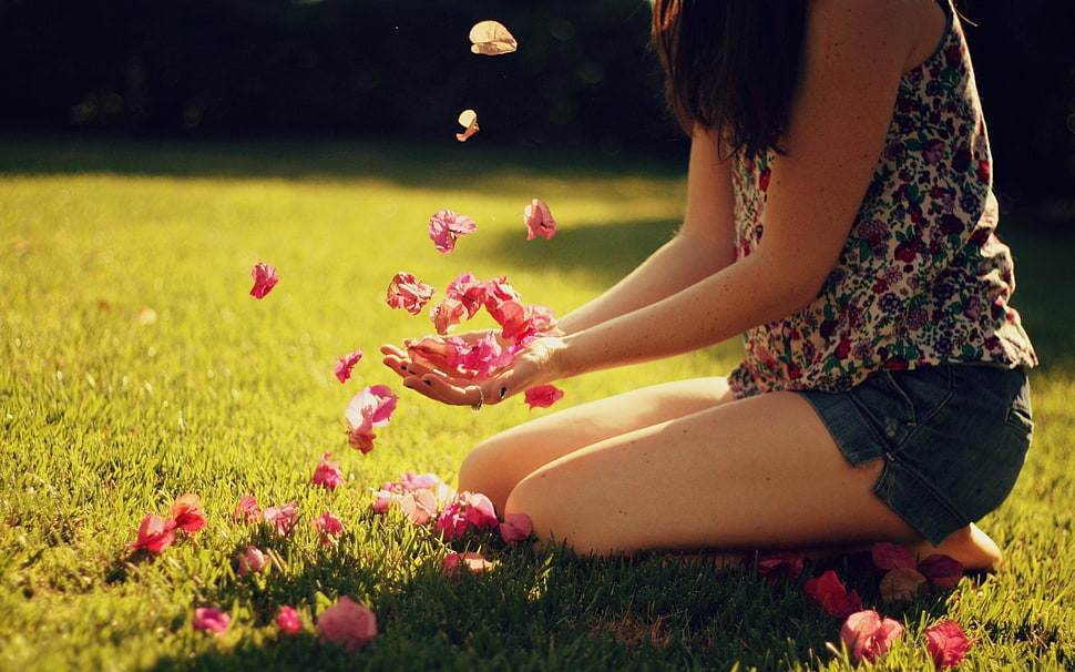 woman in multicolored floral tank top playing flowers on green field HD wallpaper