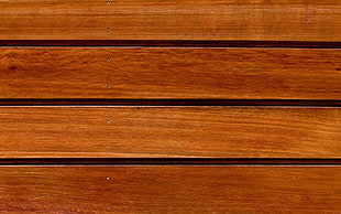 brown wooden slot-wall board