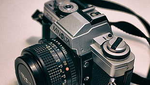 silver and black Minolta film camera