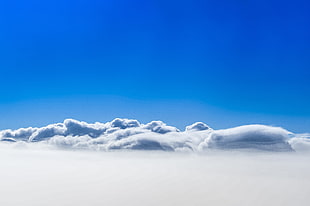white clouds and blue skies wallpaper