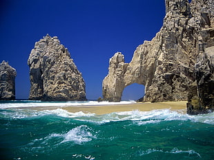 brown stone cliff, sea, beach, waves HD wallpaper