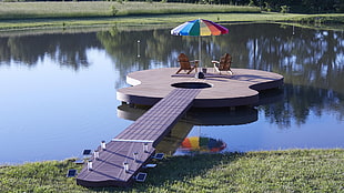 guitar-shaped brown and beige dock with two aderondak and patio umbrella HD wallpaper