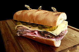 sandwich on brown wooden surface