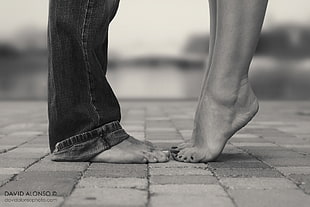 grayscale David Alonso photography of two persons standing on brick floor HD wallpaper