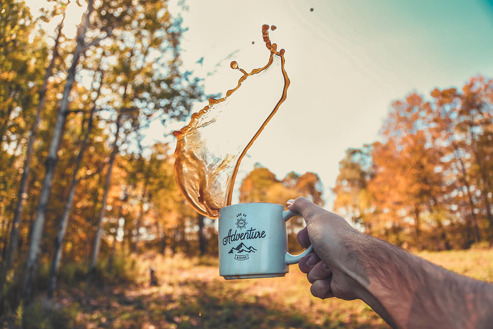 white and black Adventure-printed ceramic mug HD wallpaper