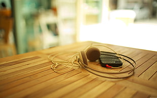 gray and white headset, iPhone