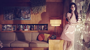 woman in beige midi dress near brown sofa HD wallpaper