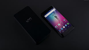 black Android smartphone with box
