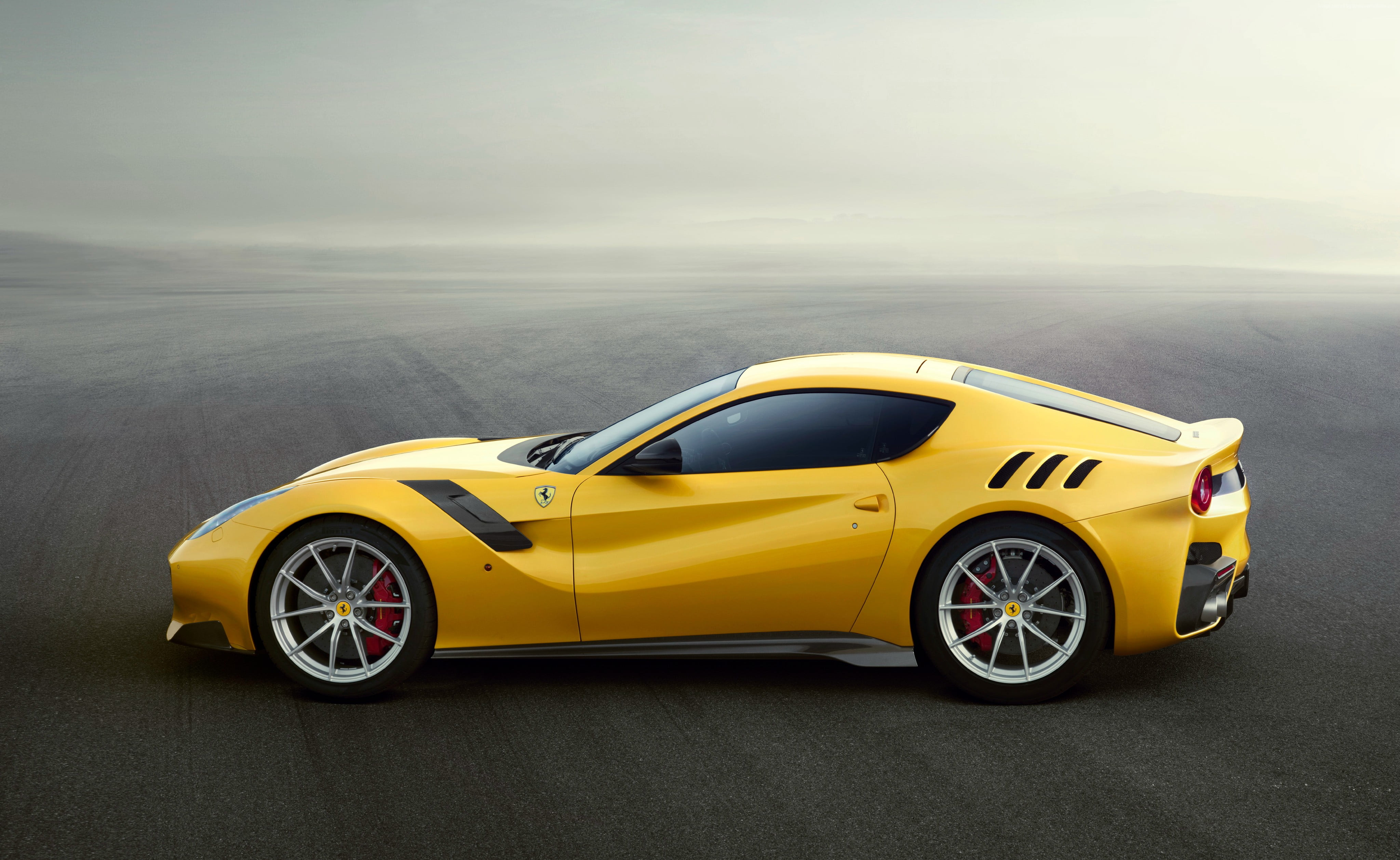 yellow Ferrari sports car