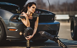 woman in studded black shirt and black leggings in front of black car photography HD wallpaper