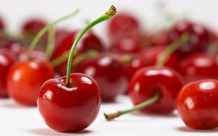 close up photo of red cherries