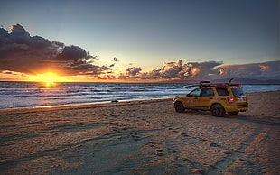 yellow SUV, beach, sunset, sea, clouds