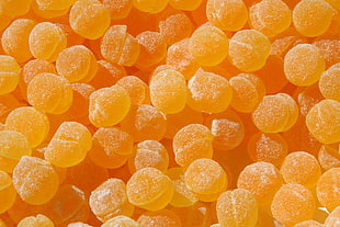 pile of yellow candies HD wallpaper