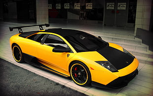 black and yellow Lamborghini Huracan parked on roadside