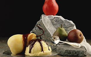 assorted fruits on gray rock photo