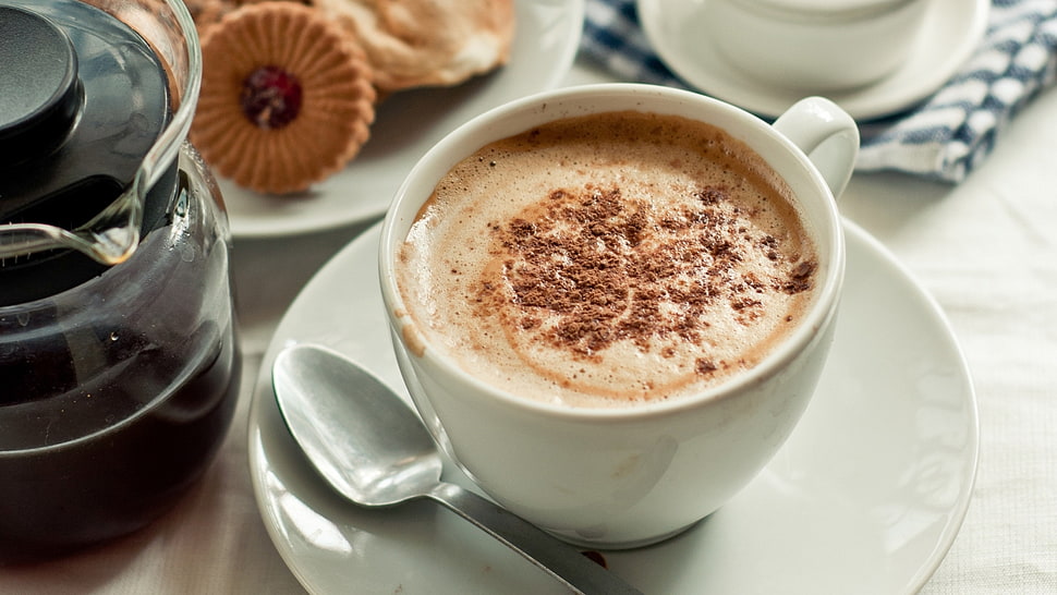 brown and white foamy coffee on white ceramic cup HD wallpaper