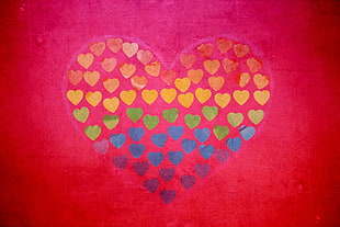red and yellow heart print textile