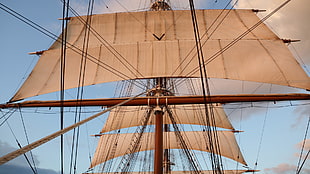 brown and black metal frame, sailing ship, sky
