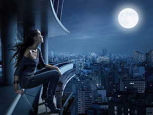 woman sitting on the edge of a building HD wallpaper