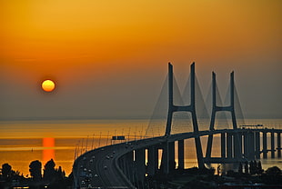 silhouette photo of concrete bridge, orange HD wallpaper