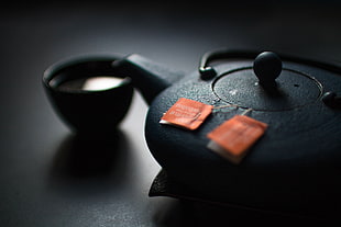 black tea cup and kettle