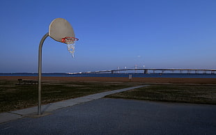 basketball court near bridge during daytime HD wallpaper