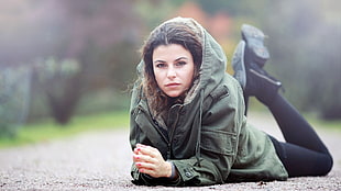 woman in black pull-over hoodie and black jeans in shallow focus photography