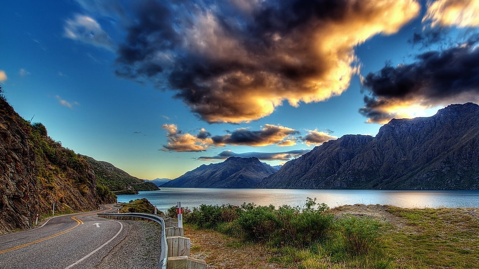 gray concrete road, road, clouds, mountains, sky HD wallpaper