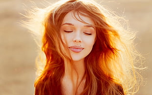selective focus photography of a woman with windy hair, women, face, redhead, closed eyes
