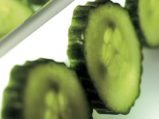 three sliced green cucumbers HD wallpaper