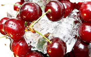 close up photography of cherries in ice