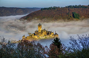 castle surrounded with clouds