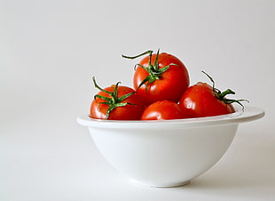 tomatoes on white ceramic bowl