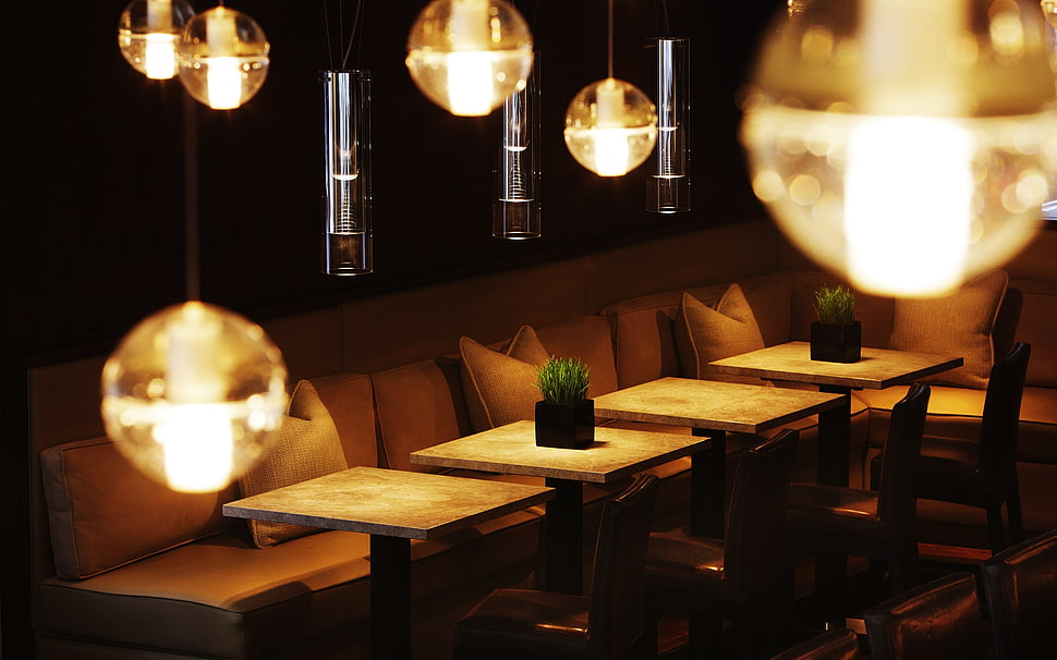 four brown wooden table with lights during night time HD wallpaper