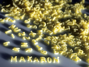 yellow letters macaroni on gray surface