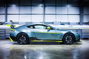 silver and yellow Aston Martin supercar