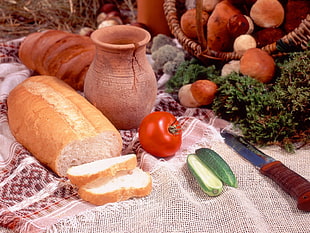 brown and white bread near brown ceramic vase
