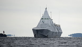 gray and white battleship on body of water