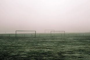 black metal stands, minimalism, landscape, mist, soccer pitches