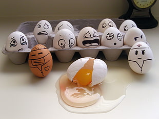 faced painted eggs and one broken egg with gray HD wallpaper