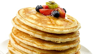 pile of pancakes in white ceramic plate