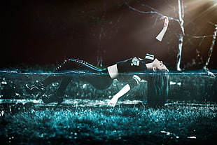 woman floating on body of water during nighttime HD wallpaper