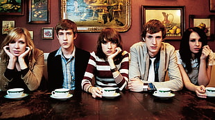five people sitting near table HD wallpaper
