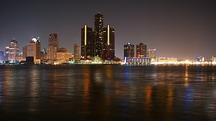landscape photo of city buildings beside body of water