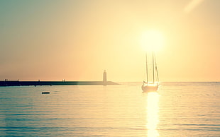 Sun, sea, boat, lighthouse HD wallpaper