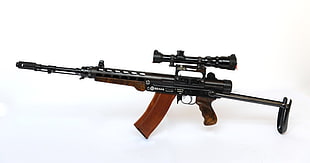 black and brown assault rifle with scope