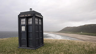 payphone booth in green grass field, Doctor Who
