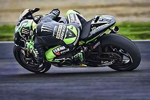 man riding in black and green Yamaha sports bike during daytime HD wallpaper