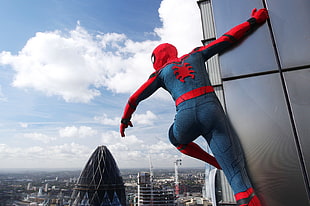 Spider-Man holding glass building near black tower HD wallpaper